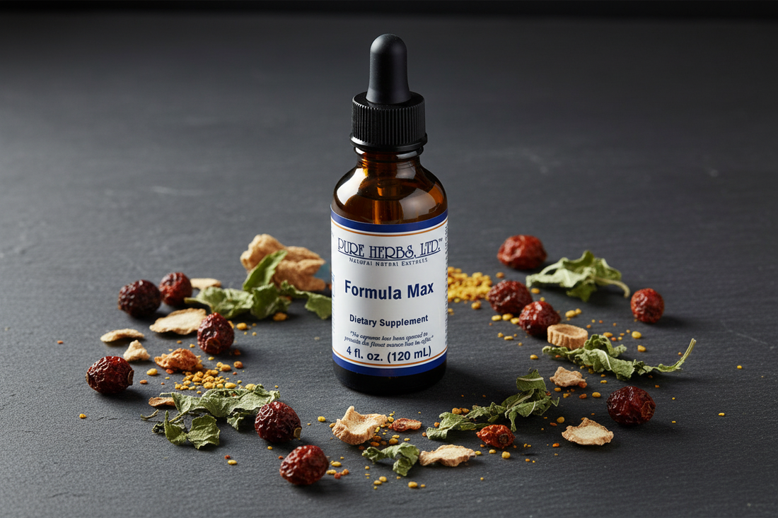 Formula Max herbal tincture bottle surrounded by dried botanicals including hawthorn, dandelion, and licorice root