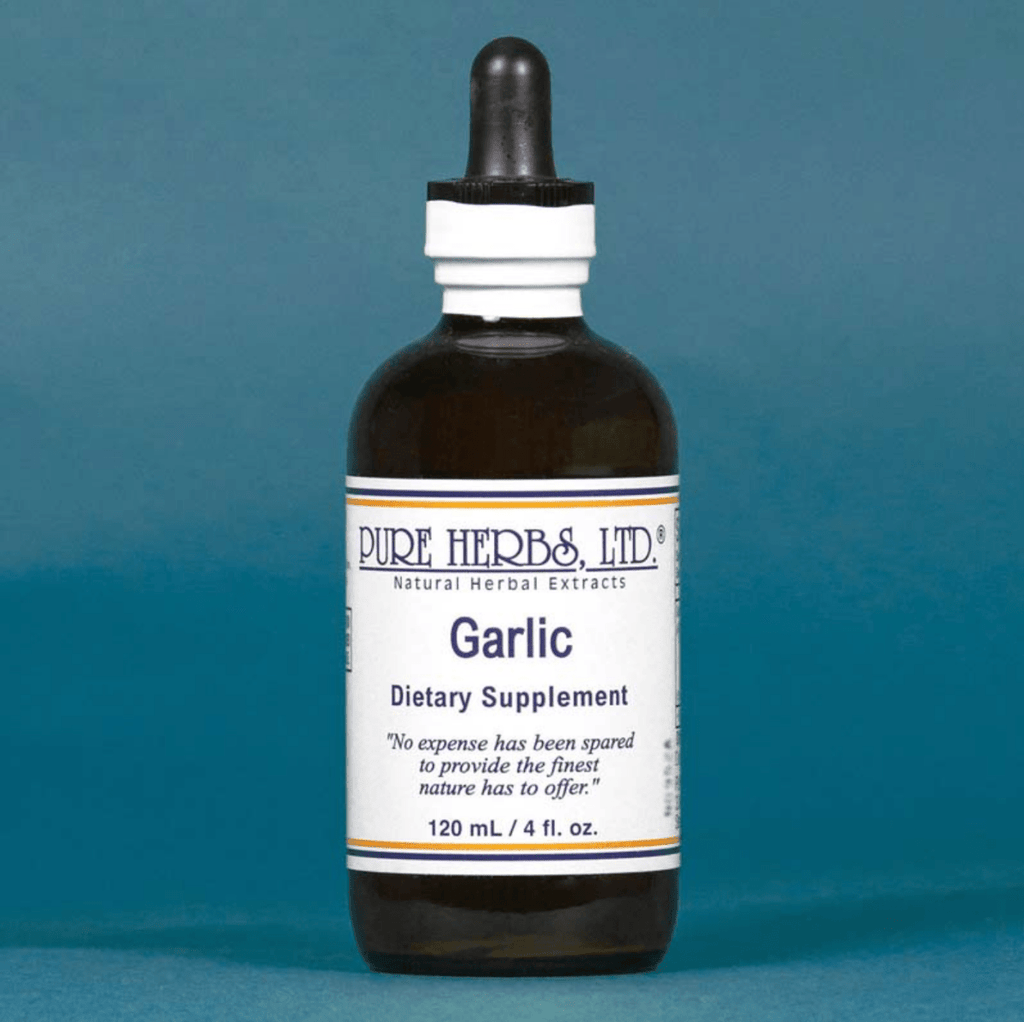 A 120 mL amber glass dropper bottle of Pure Herbs Ltd. Garlic Dietary Supplement, featuring a white label and black dropper cap, set against a solid teal-blue background.