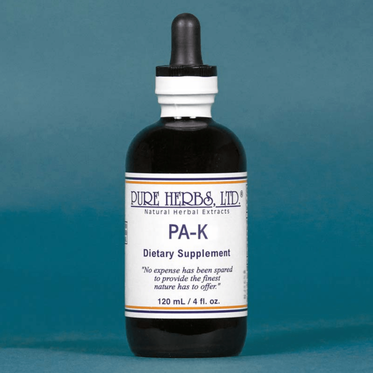 A dark amber glass dropper bottle of Pure Herbs Ltd. PA-K dietary supplement, featuring a white label with blue text, set against a solid slate blue background.
