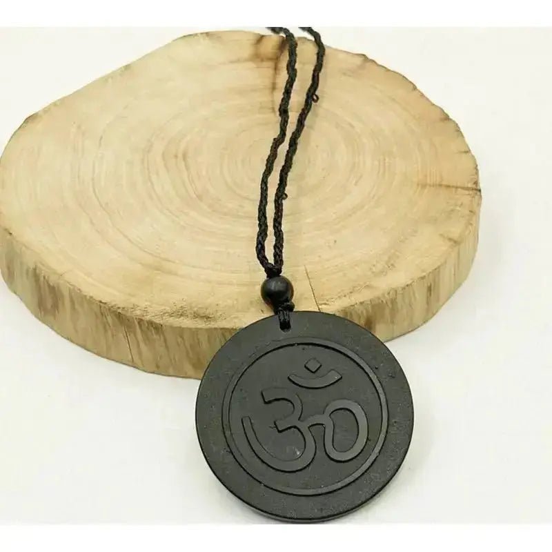 Shungite round pendant with Aum symbol engraving – EMF Protection & Energy Balancing Stone - Futures ETC